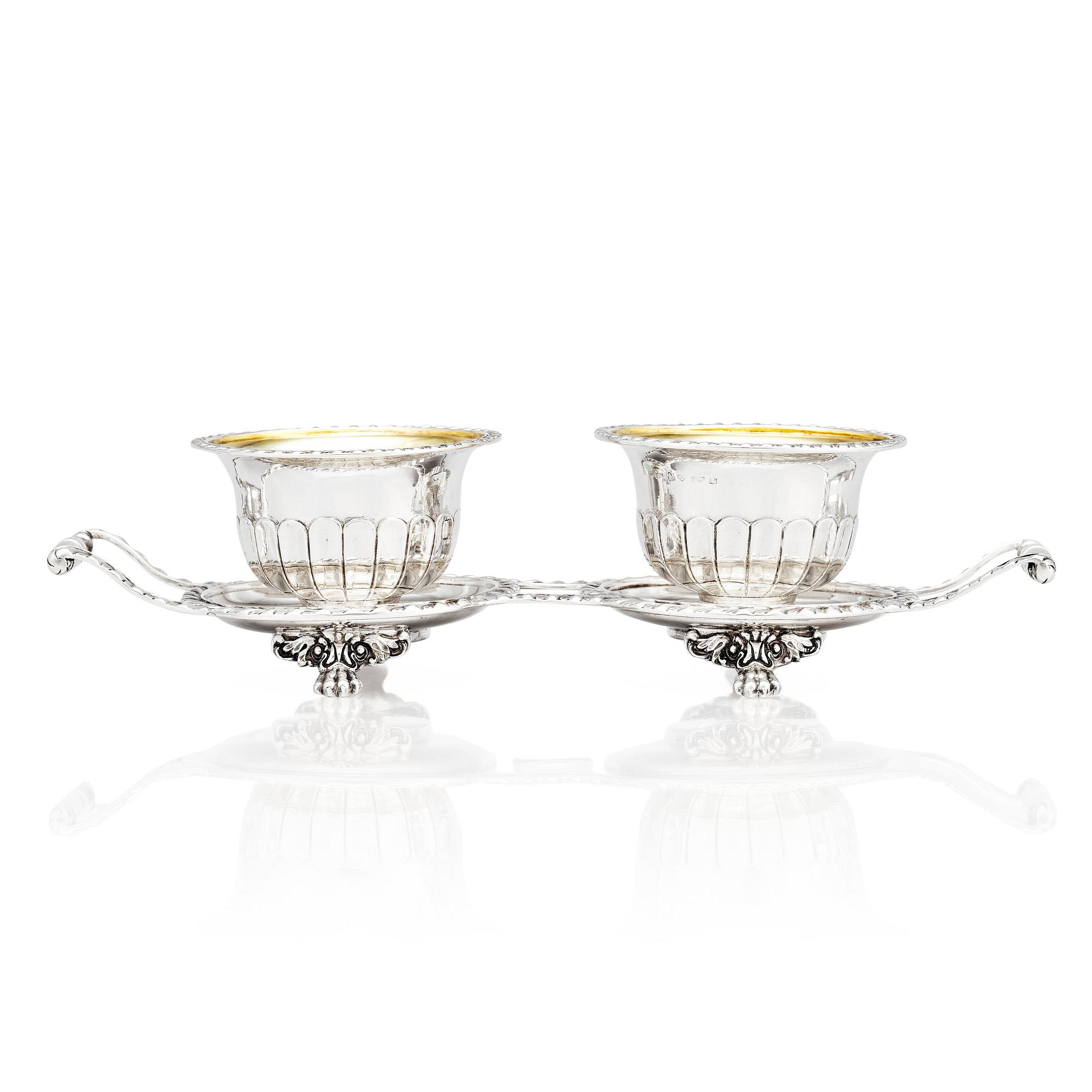 A pair of Swedish candy bowls with stand, parcel-gilt silver, mark of Gustaf Möllenborg, Stockholm 1851.