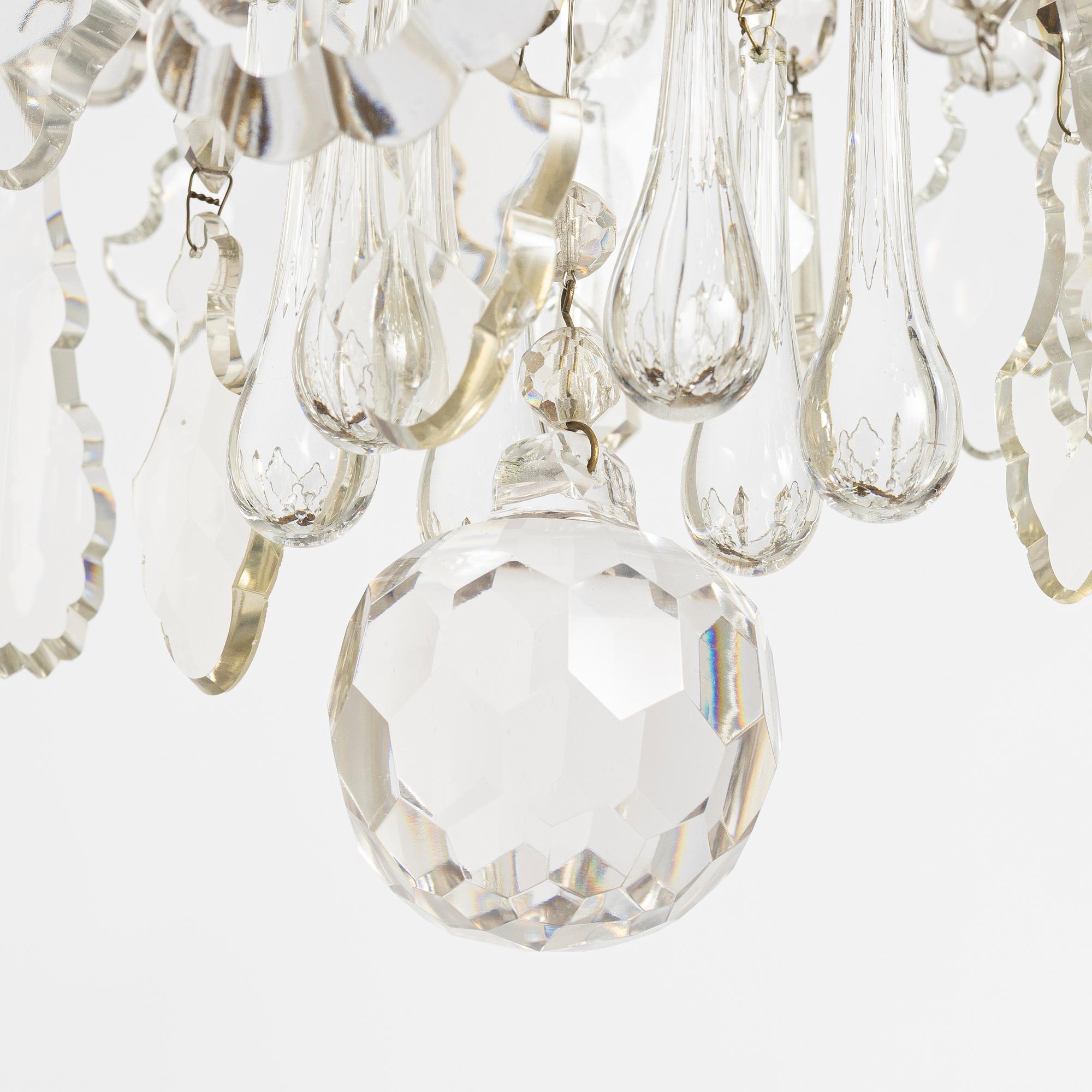 A six-branch rococ-style chandelier, first part 20th century.