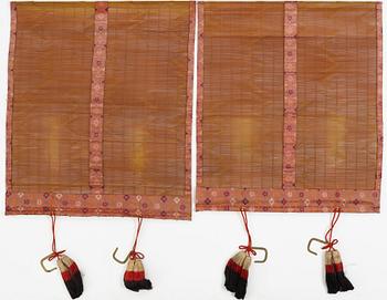 Two Japanese curtains and a wooden panel, 20th Century.