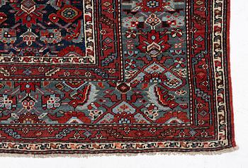 A Malayer runner, west Persia, c. 560 x 200 cm.