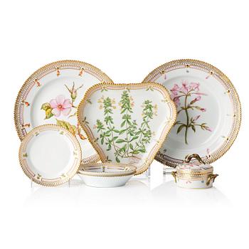 A set with a Royal Copenhagen 'Flora Danica' triangular dish, a sugar bowl with cover and three small dishes, Denmark,