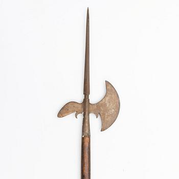 An 20th Century wood and iron halberd.