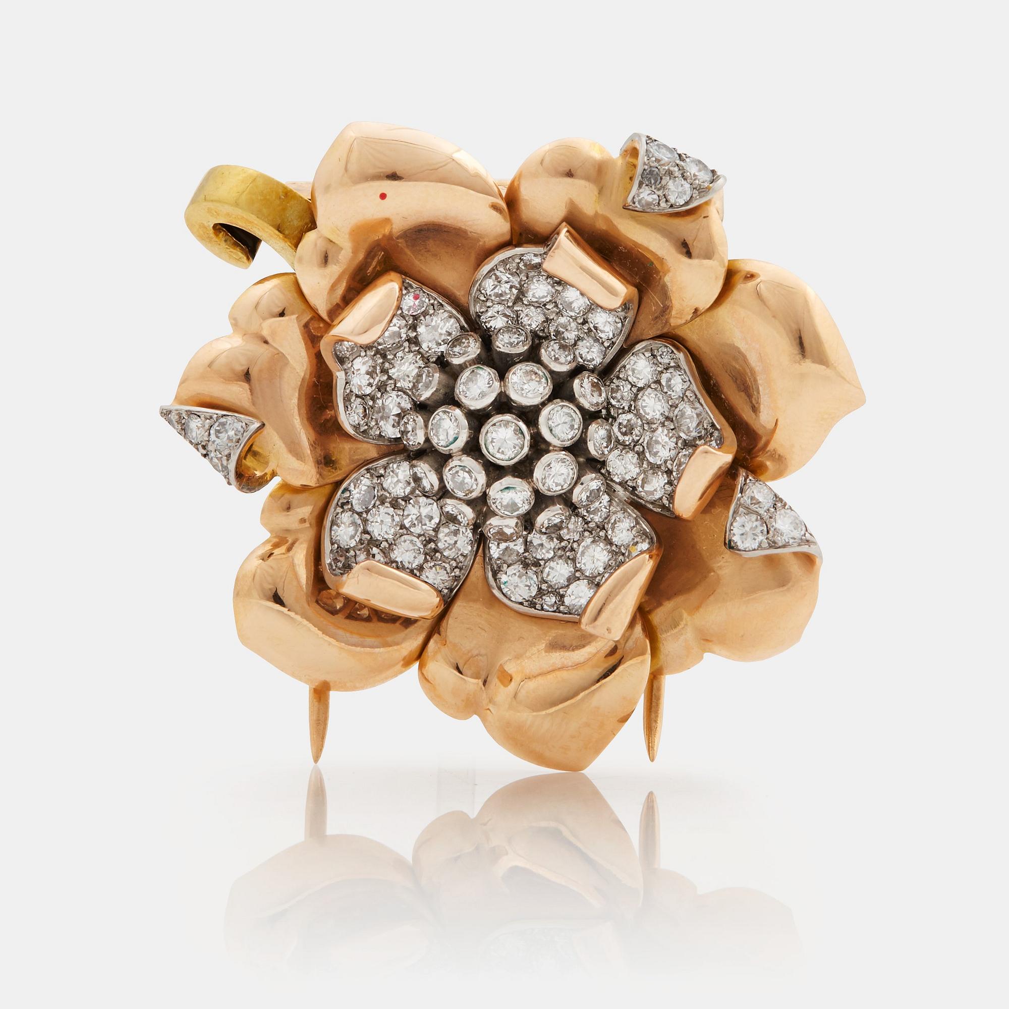 A 1940/50s brooch by Boucheron, in the shape of a flower, set with brilliant cut diamonds.