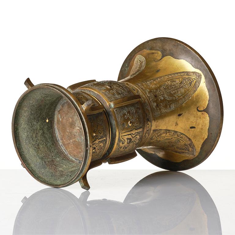 A parcel gilt/gold splashed bronze vase, Gu, 17/18th century.