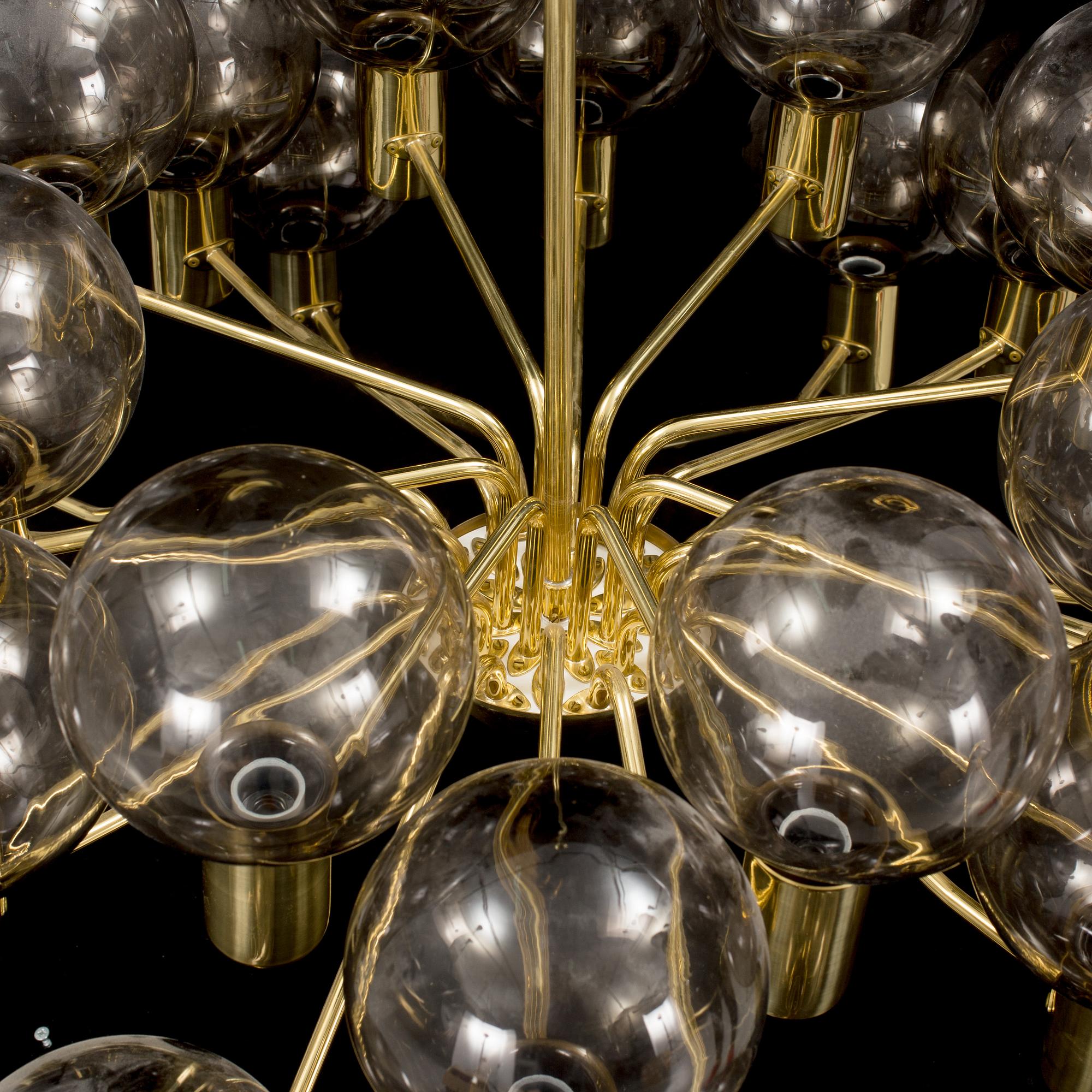 A brass ceiling light by Hans-Agne Jakobsson.