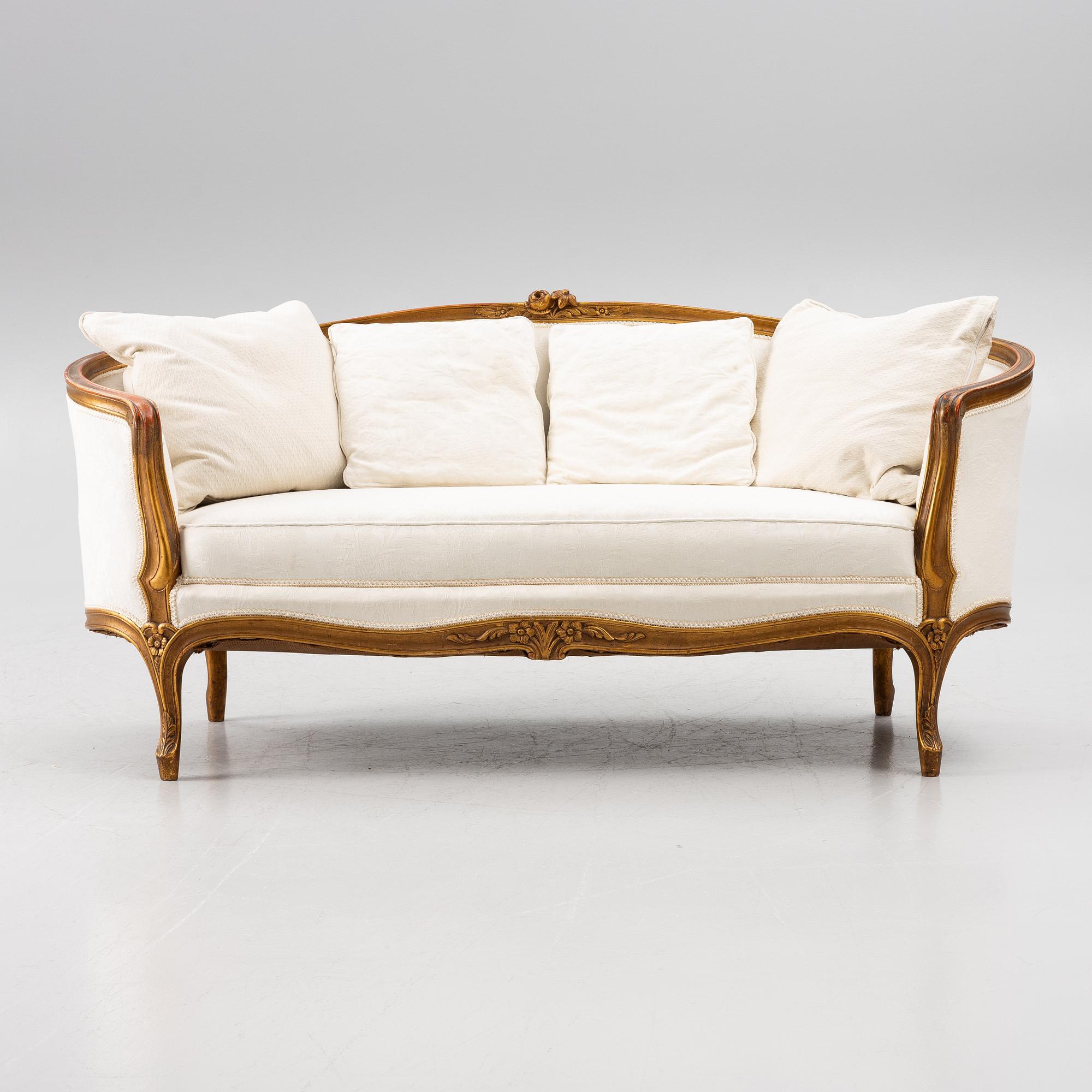 A Louis XV-style sofa, early 20th century.