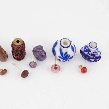 Nine snuff bottles, Peking glass, lacquer, stone and mother of pearl, China, 20th century.