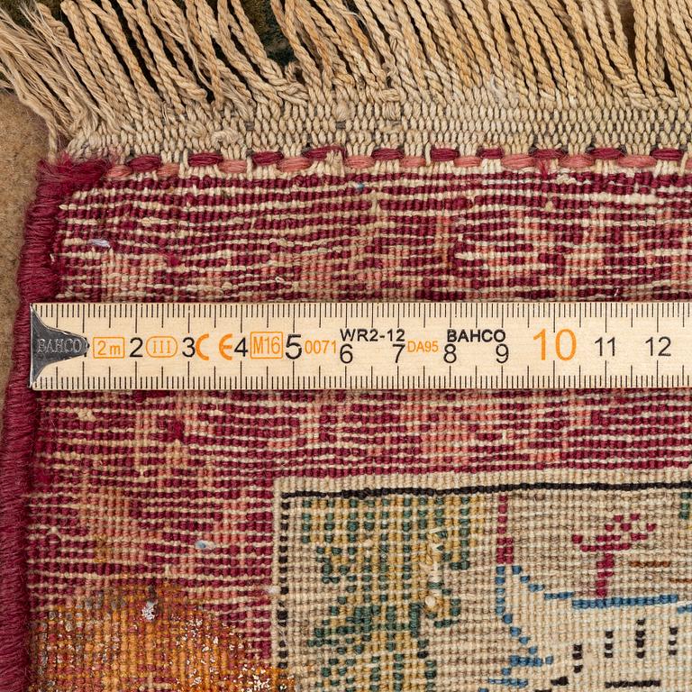 A semi-antique pictoral Kashan carpet, Central Persia, c. 214 x 130 cm.