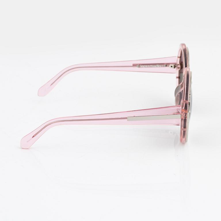 Karen Walker, a pair of pink "Orbit" sunglasses.