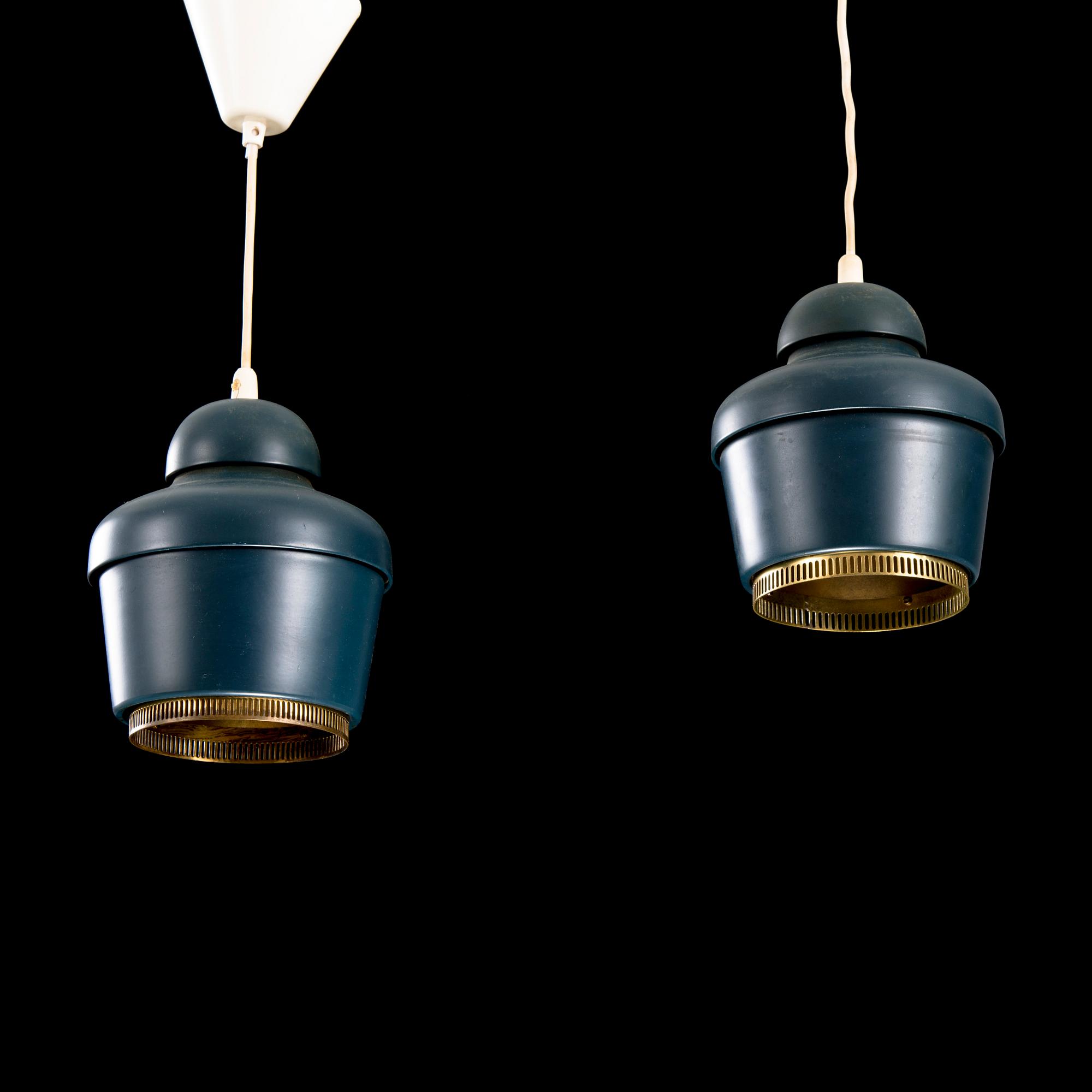 A pair of 'A330' ceiling lamps for Valaistustyö.