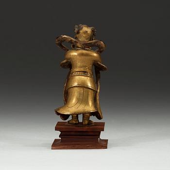 A gilt bronze figurine of a standing boy, Ming dynasty, 17th century.