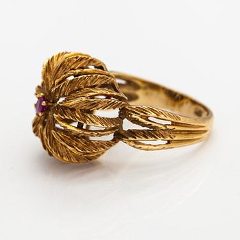 An 18K gold ring with a ruby.
