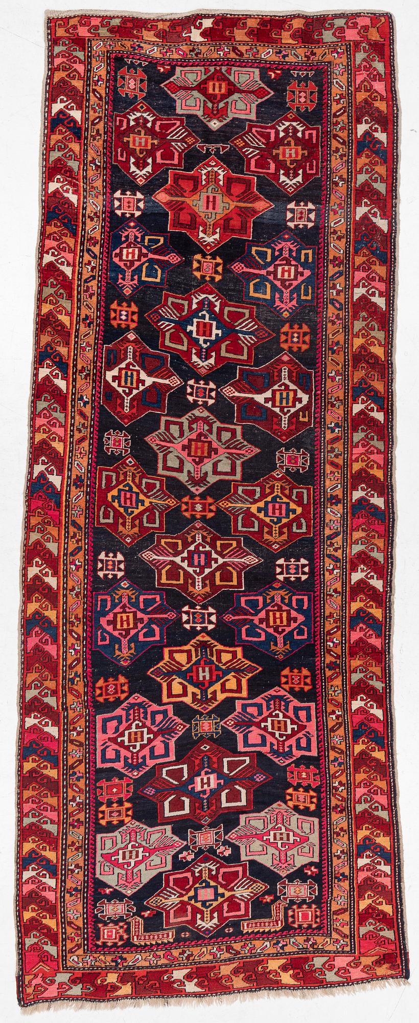 A semi-antique Anatolian runner, c. 409 x 159 cm.