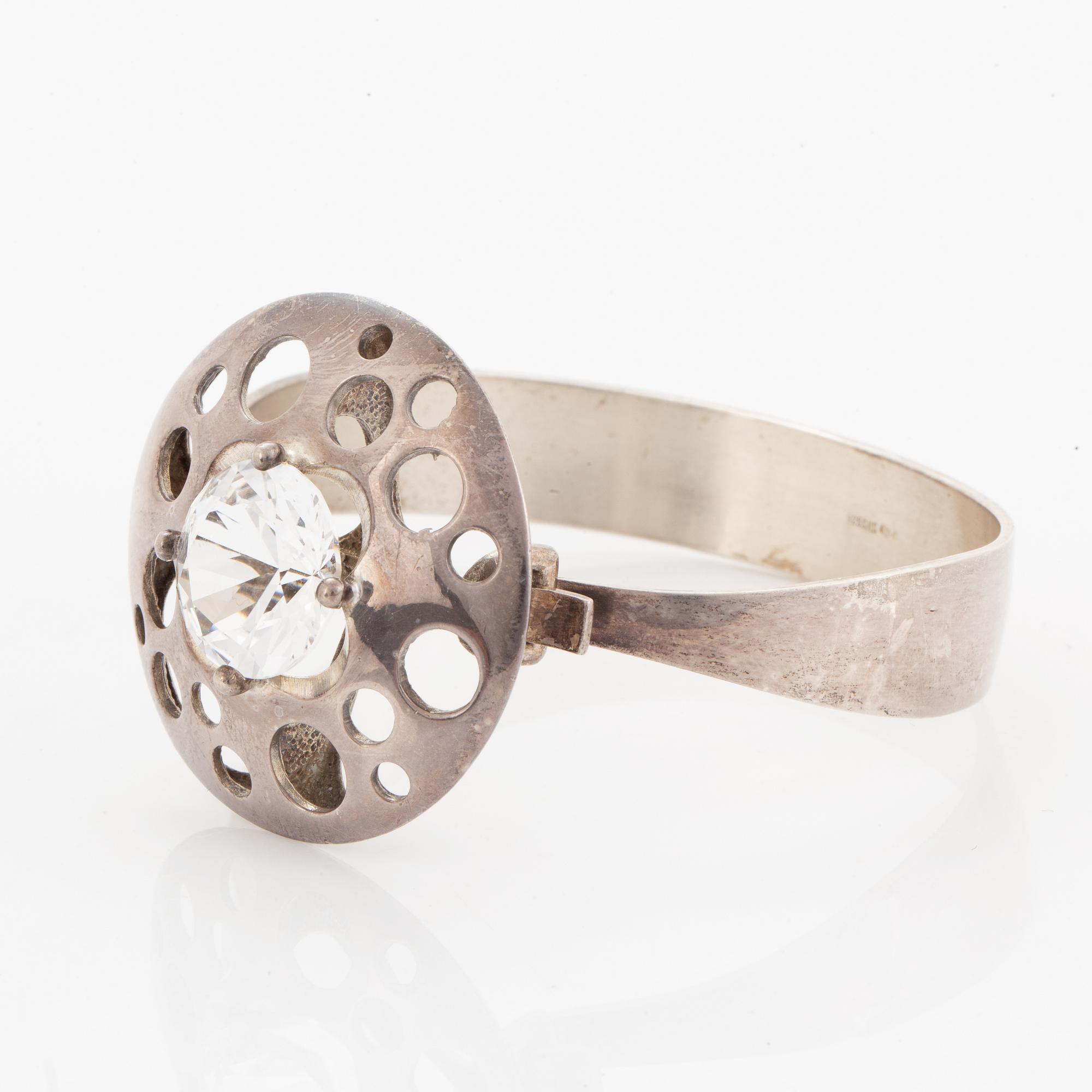 Bangle, ring and necklace, silver with colourless stones.