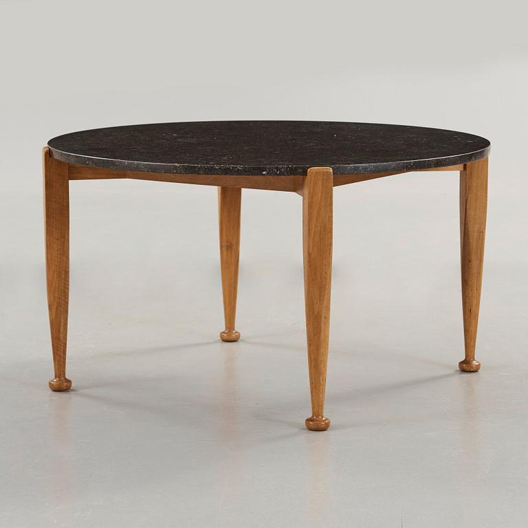 Josef Frank, a black marble top table, model 960, walnut base, Svenskt Tenn, 1950's.