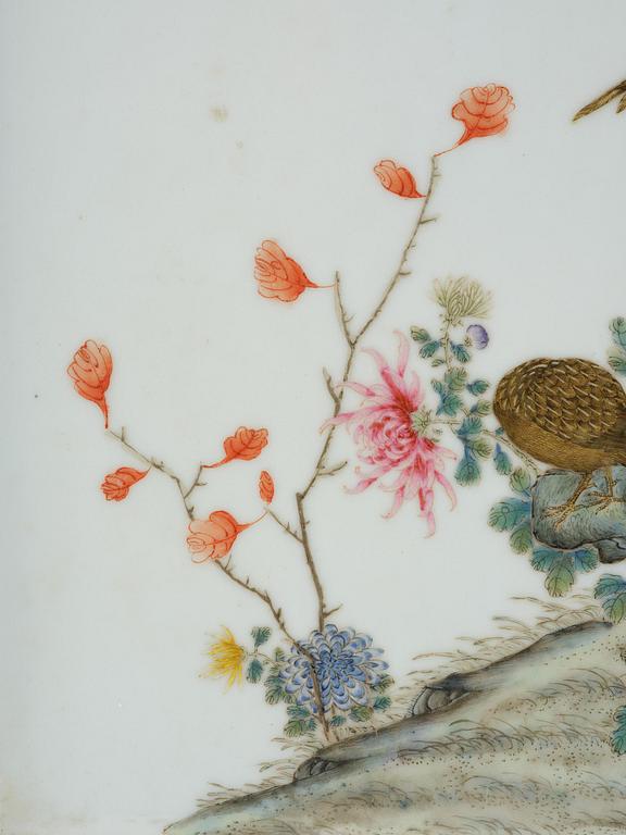 A set with four Chinese porcelain panels with a wooden frame, first half of 20th century.