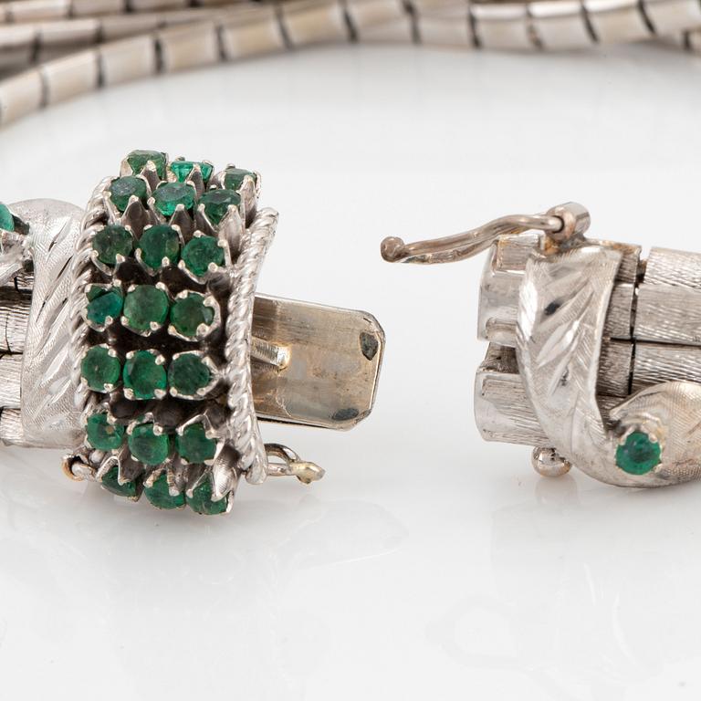 An 18K white gold bracelet set with faceted emeralds.