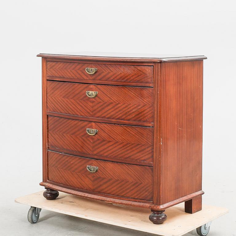 An early 1900s mahogany dresser.