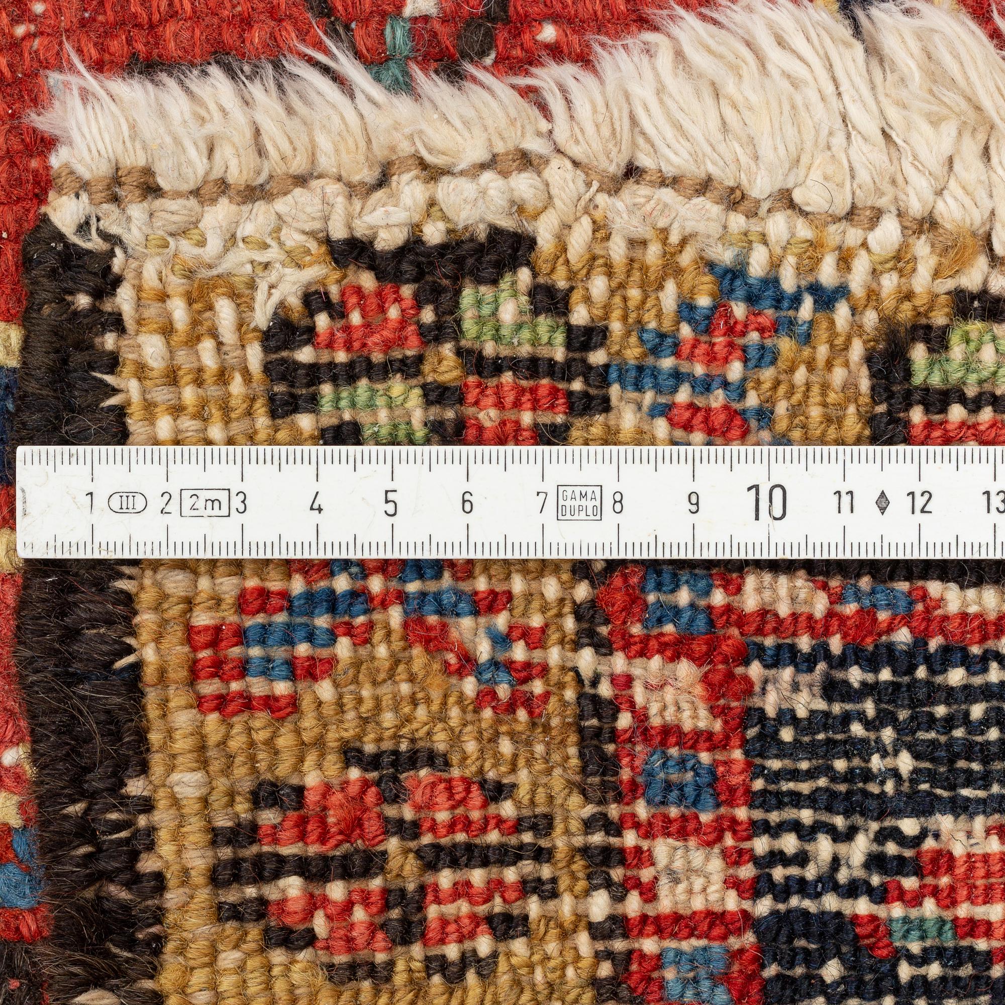 A semi-antique Karadja carpet, ca 376 x 297 cm.