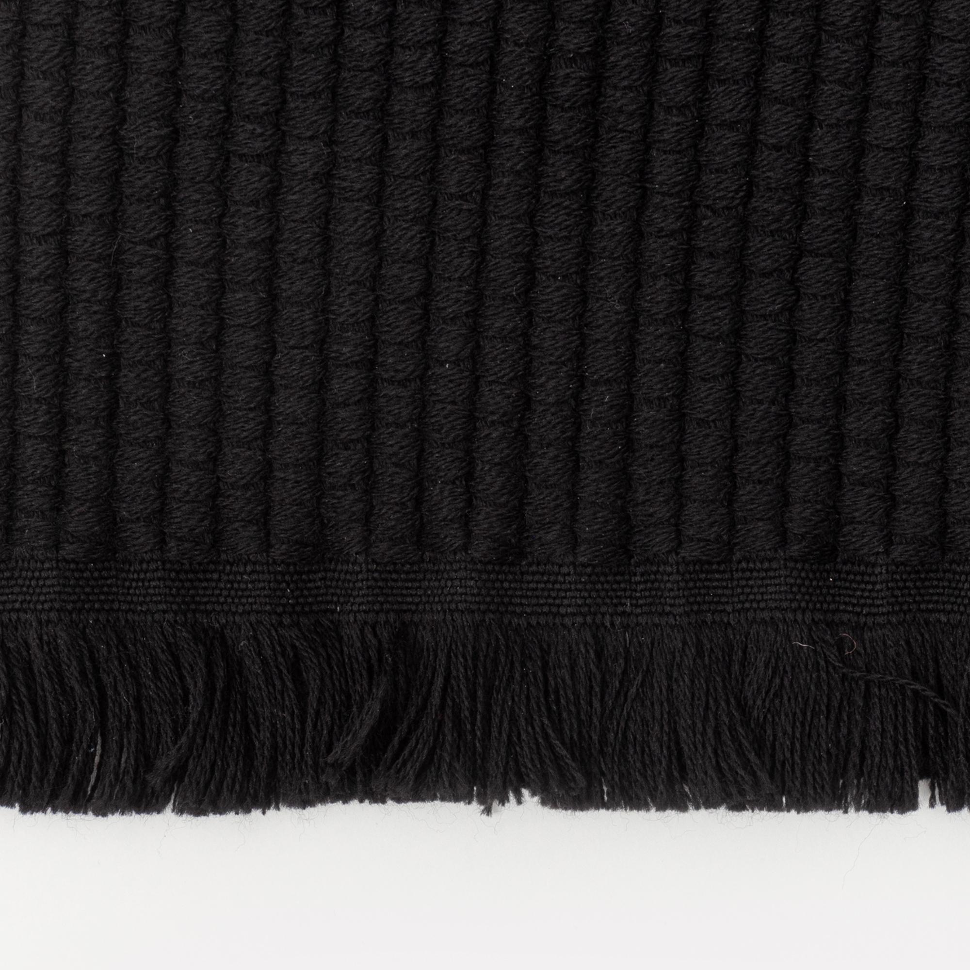 Gucci, a black wool scarf.