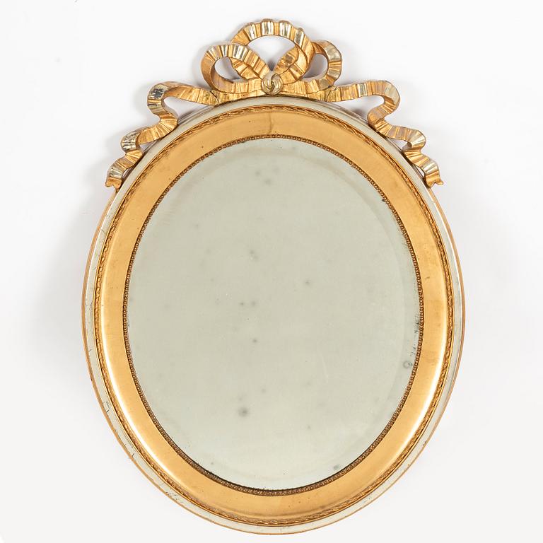 A gustavian style mirror, first half of the 20th century.