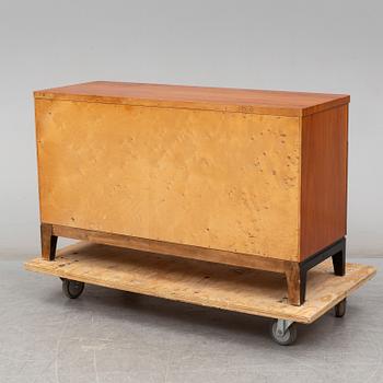 A walnut veneered chest of drawers, 1930's.