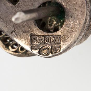 A bracelet and pair of earrings in silver with turquoises. Import marked Risto Aho, Helsinki 1964.