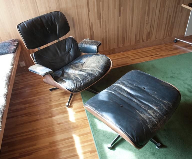 A LOUNGE CHAIR AND OTTOMAN.