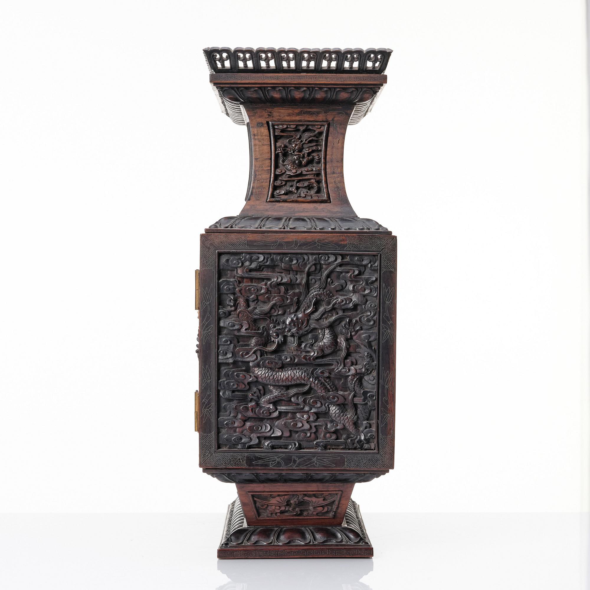 A hardwood dragon cabinet, Qing dynasty 18/19th Century.