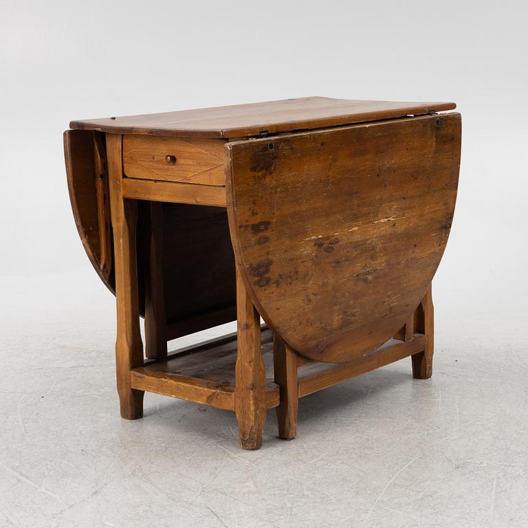 An 19th century drop-leaf table.