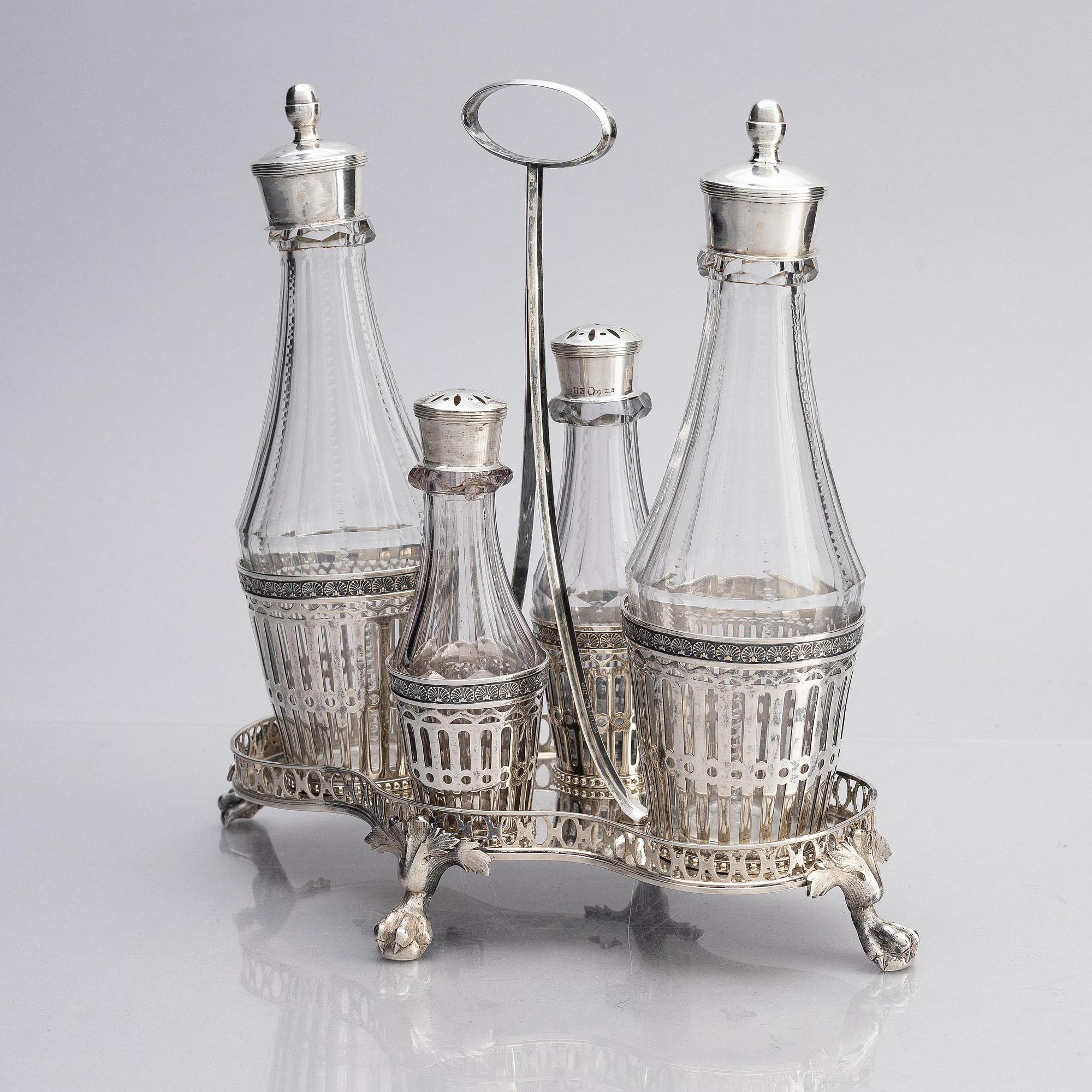 A Swedish 18/19th century silver and glass cruet-set, mark of Pehr Zethelius and Paul Wihlborg, Stockholm 1795 and 1814.