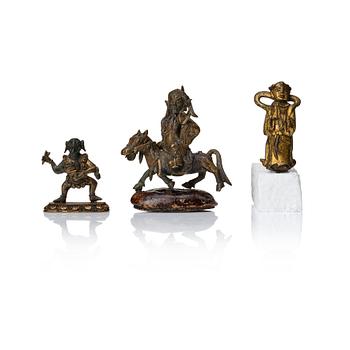 886. A group of three bronze miniatures sculptures of deities, China and Tibet, 18th Century.