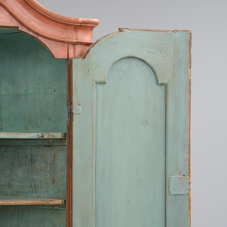 A rococo corner cabinet, later part 18th century.
