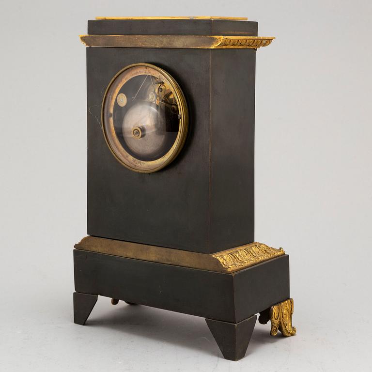 An Empire-style late 19th century mantel clock.