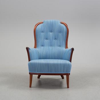 An "Vår Fru" armchair by Carl Malmsten.