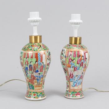 A pair of famille rose Canton table lamps and a pair of vases, late Qing dynasty, 19th Century.