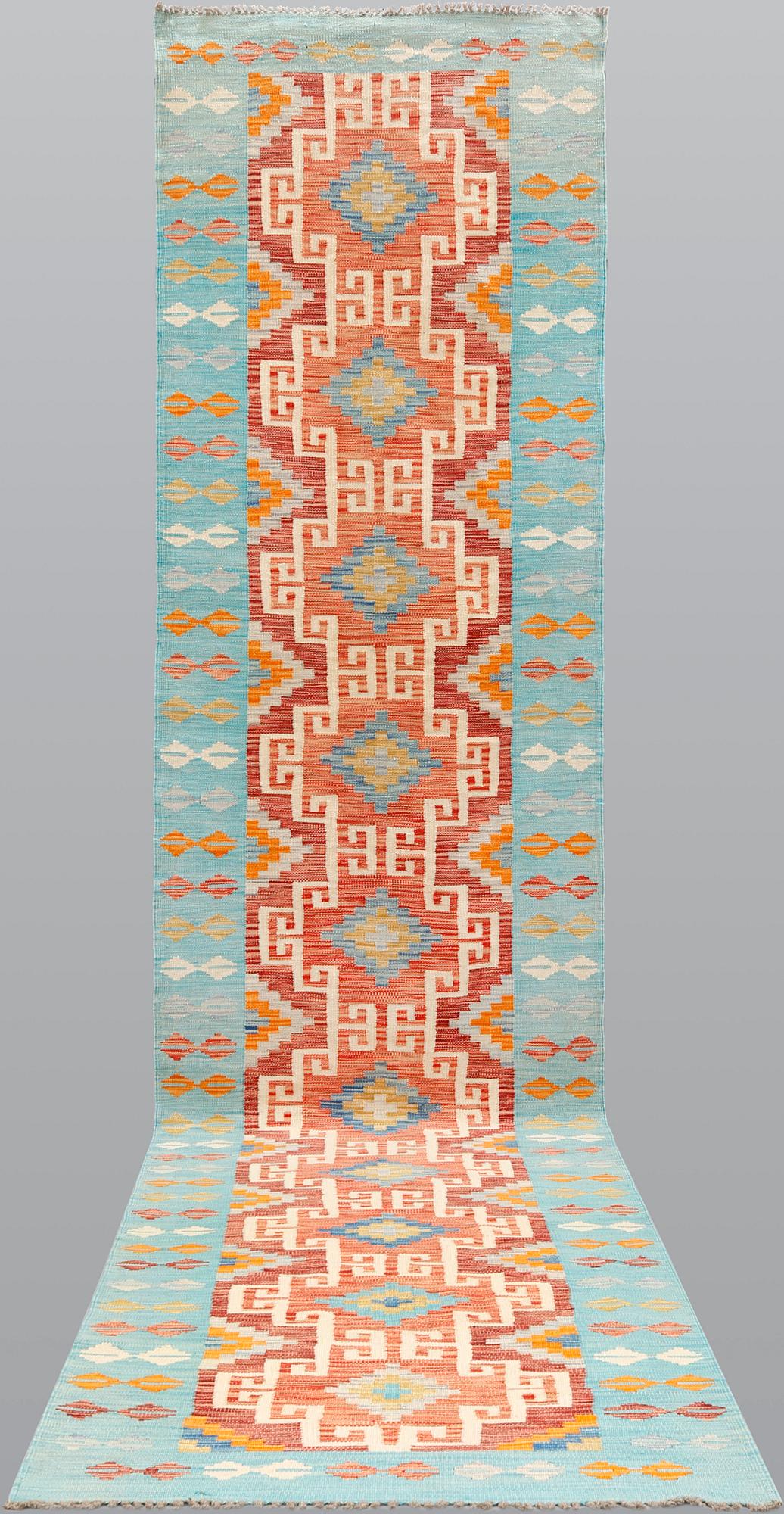 A kilim runner, ca 492 x 100 cm.