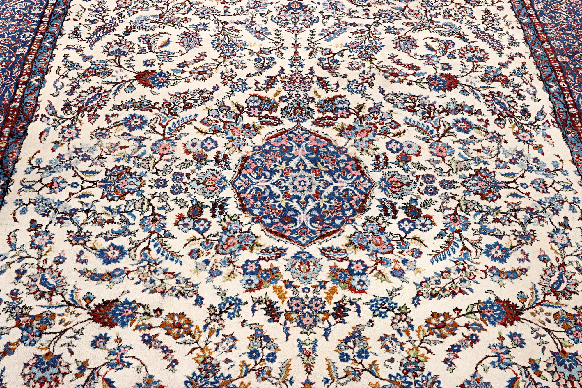 An oriental carpet, c. 308 x 220 cm.