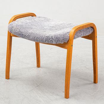 Yngve Ekström, a 'Lamino'  shearling upholstered lounge chair and foot stool from Swedese.