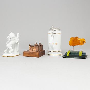 Four sculptures and a jug.