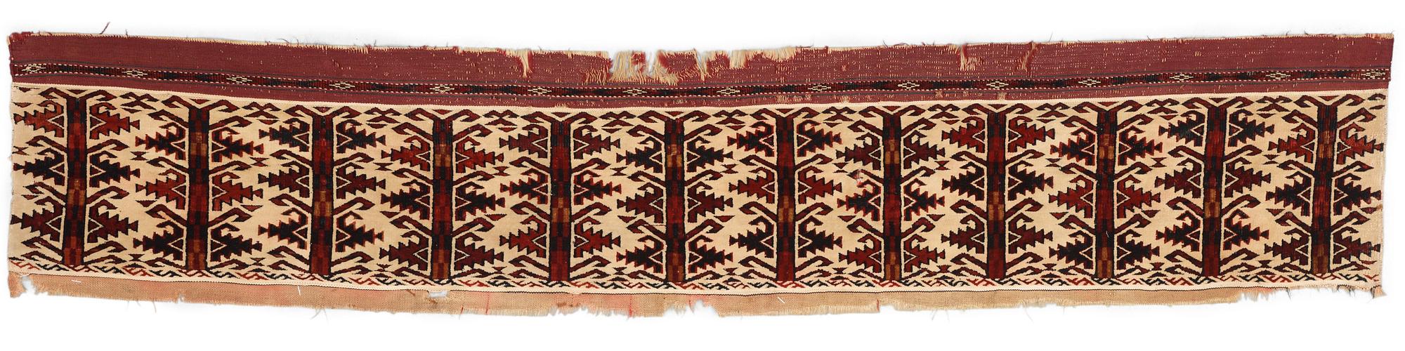 ANTIQUE TURKMEN FRAGMENT. Probably fragment of a kapunuk or a jollar. 24 x 130 cm.