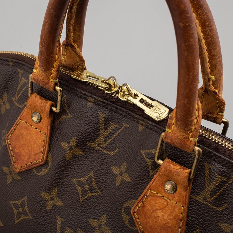 a LOUIS VUITTON 'Alma' bag.