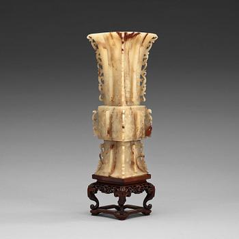 1414. A Chinese archaistic nephrite beaker vase (Gu).