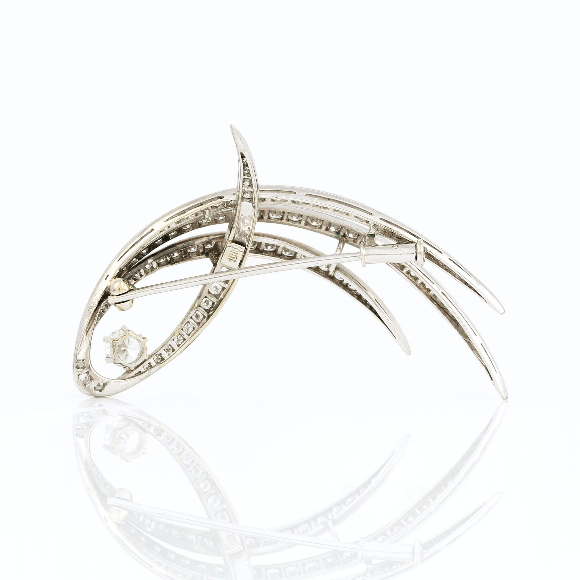 BROSCH, 18K vitguld med briljanter diamanter, tot ca 0,99 ct. Vikt ca 8,30 g.