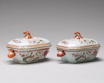 A pair of famille rose 'double peacock' butter tureens with cover and stand, Qing dynasty, Qianlong (1736-95).