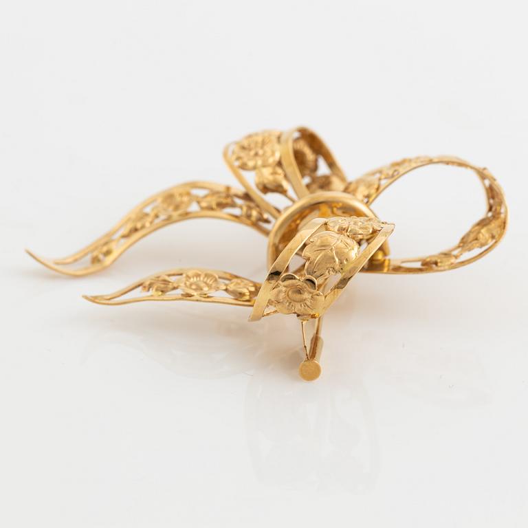 18K gold bow brooch.