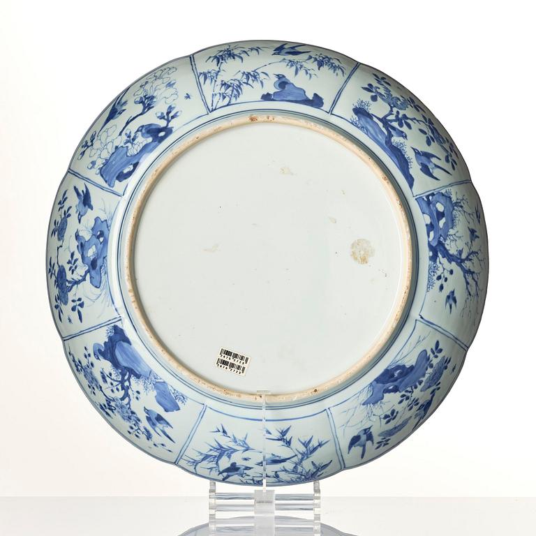 A rare and massive blue and white scalloped dish, Qing dynasty, Kangxi (1662-1722).