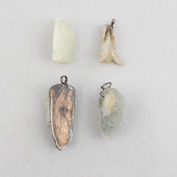 A group of eight Chinese stone charms / pendants, 20th century.