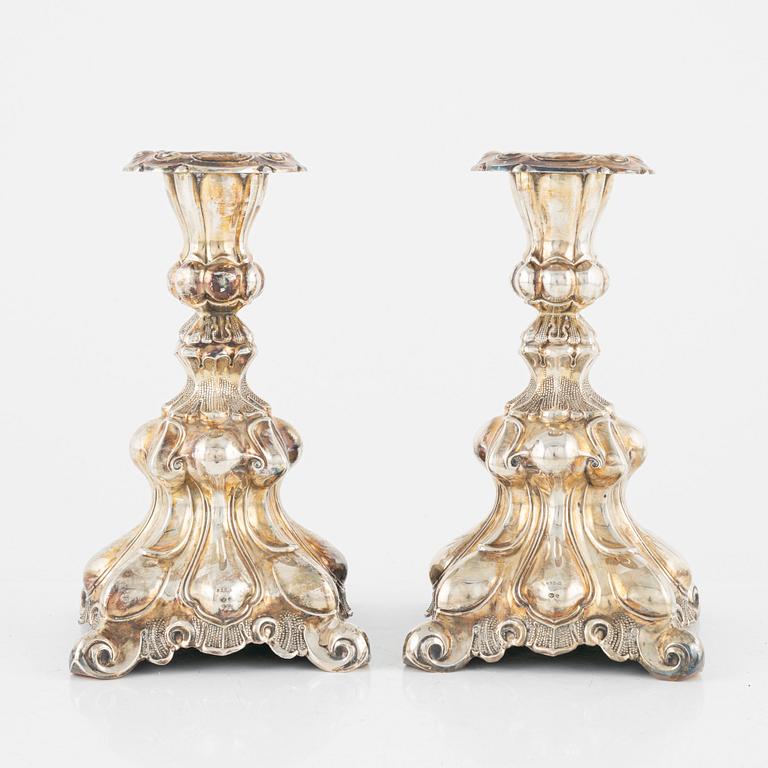 A pair of Baroque style silver candlesticks, early 20th Century.