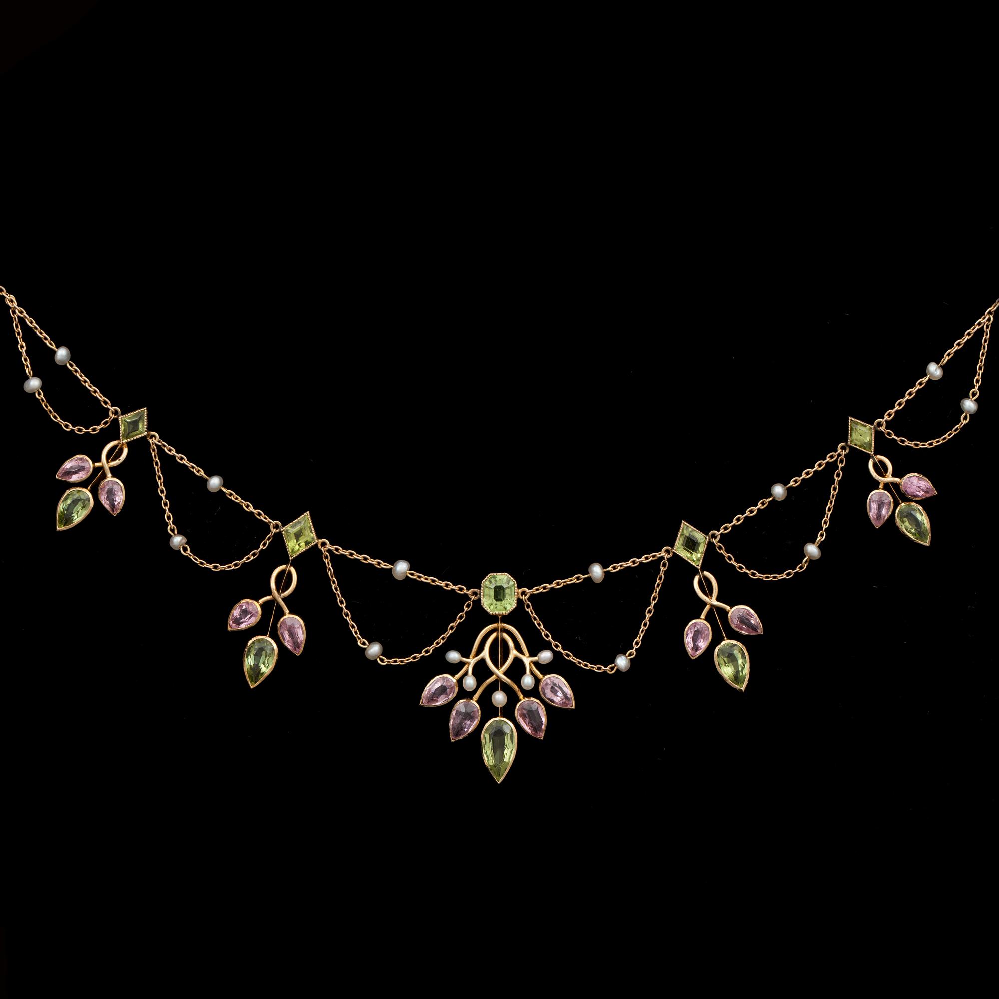 A pearl, peridote and pink tourmaline necklace. Circa 1900.